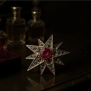 Vintage Joan Rivers Gold Tone Rhinestone Starburst Brooch